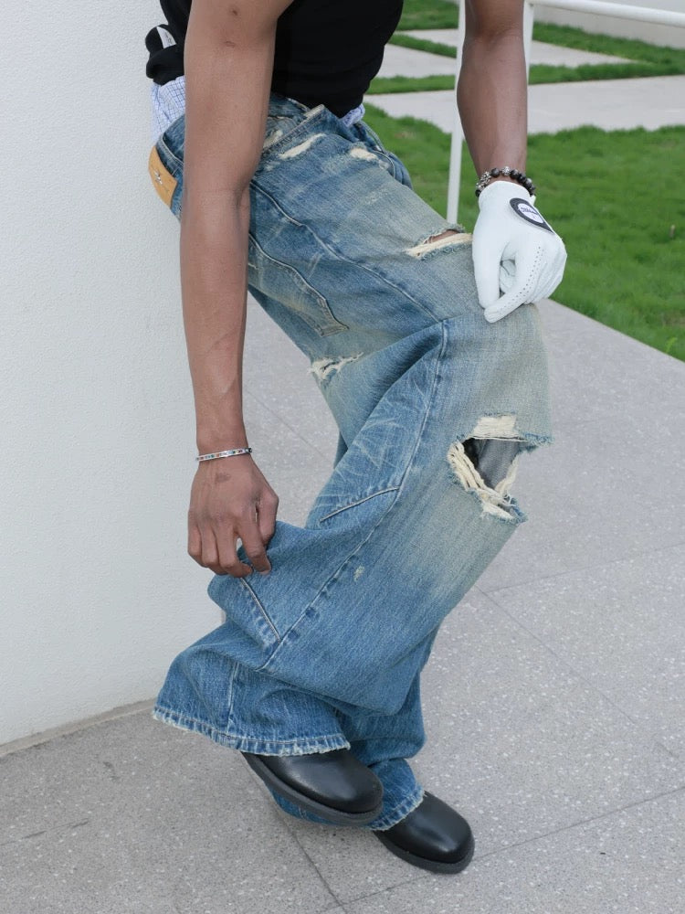 Hole punched cat’s mustache baggy straight jeans