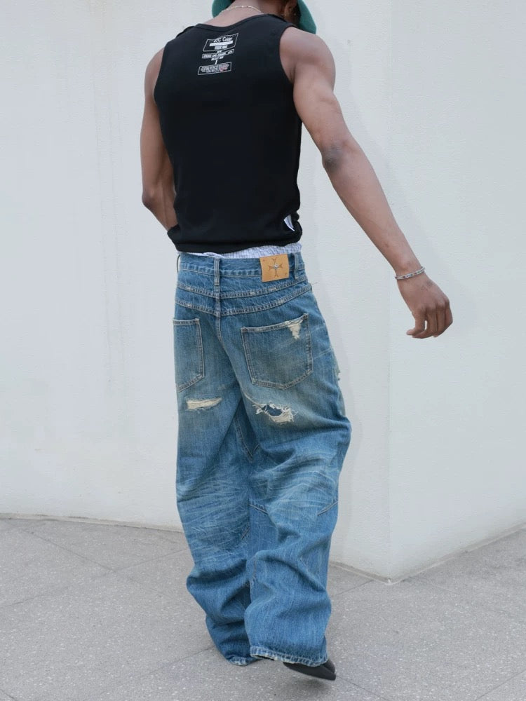Hole punched cat’s mustache baggy straight jeans