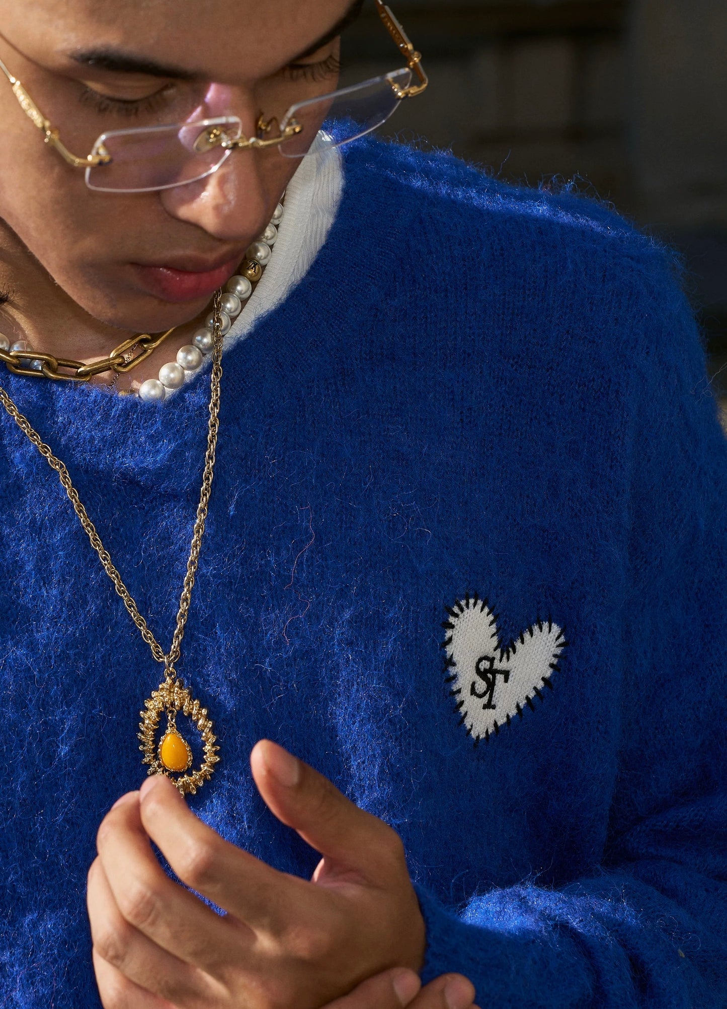 Crimson flame heart emblem wool sweater