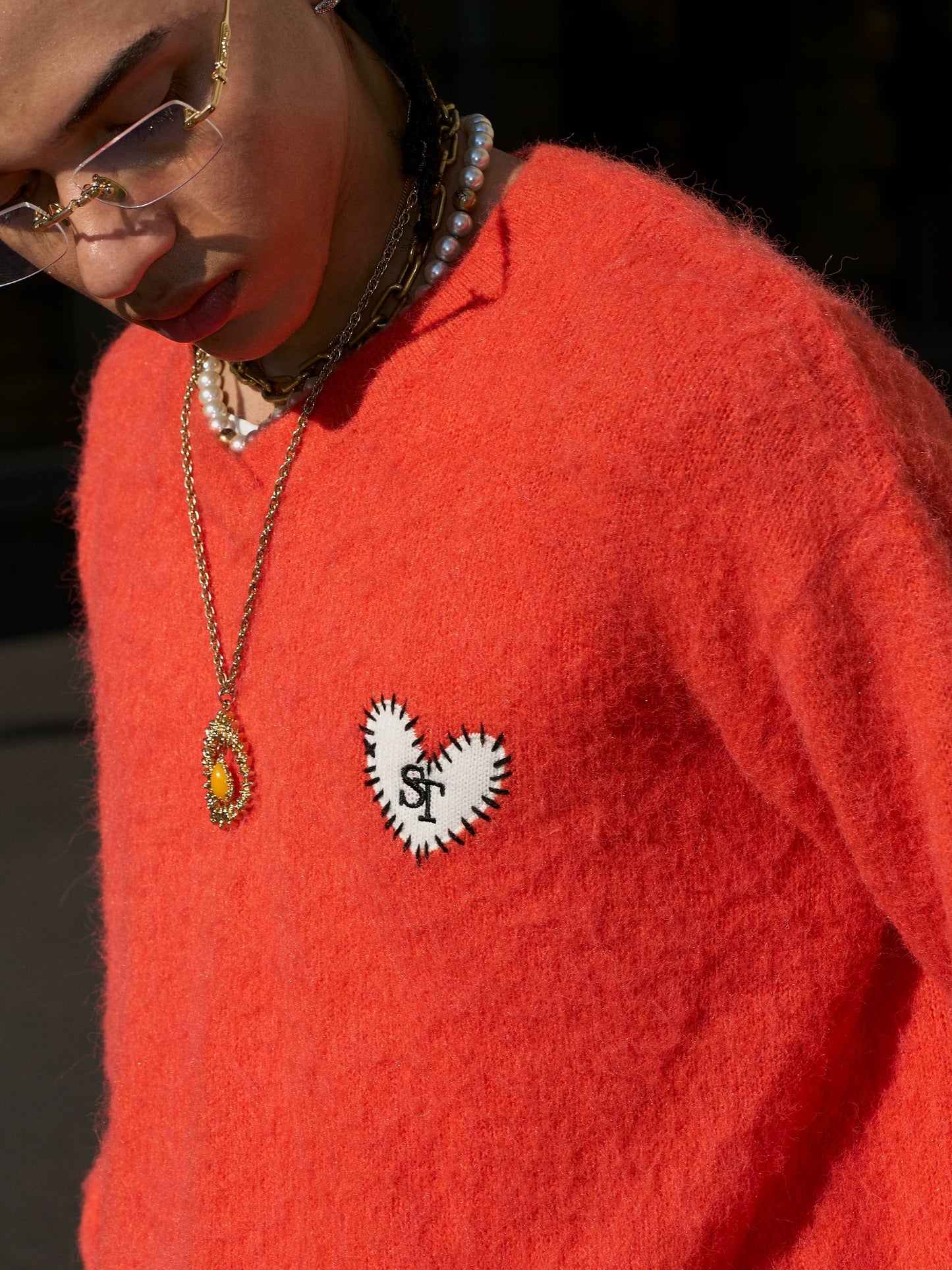 Crimson flame heart emblem wool sweater