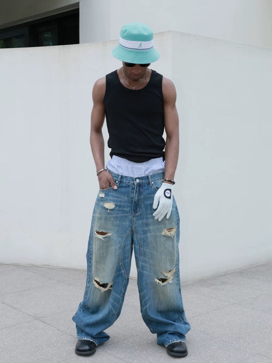 Hole punched cat’s mustache baggy straight jeans