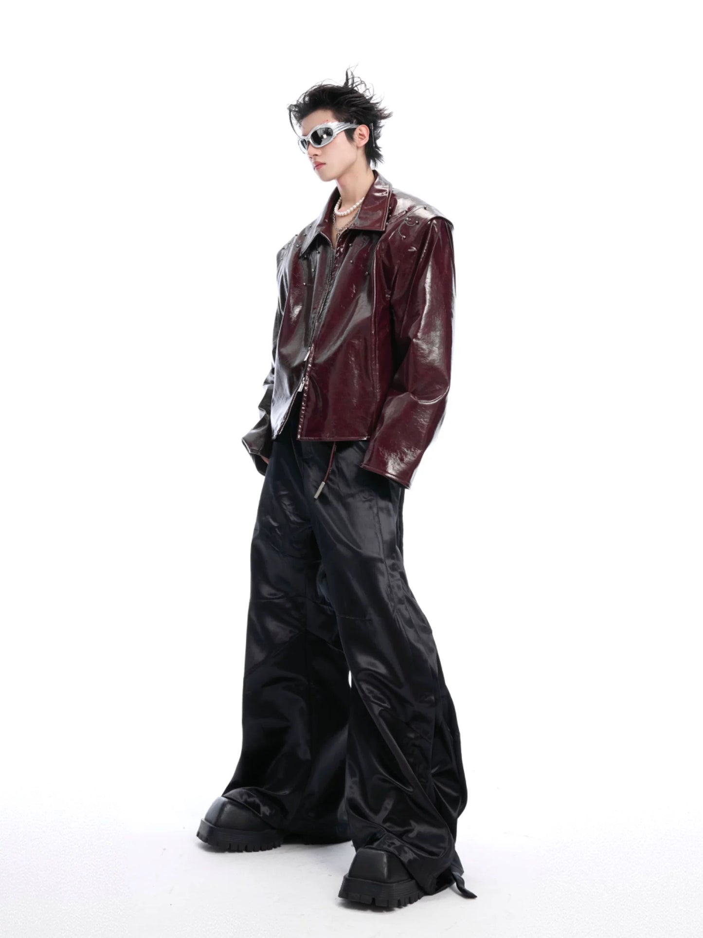 Deceptive eye spine rivet shiny leather jacket